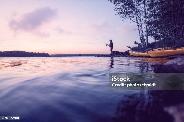 Fisher At A Beautiful Lake At Low Light Stock Photo - Download Image Now - Fishing, Sweden, Sunset