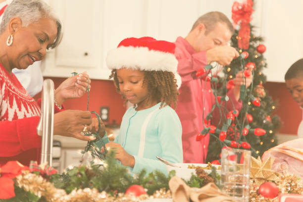 istock Multi-ethnic family in home kitchen decorating for Christmas. 870150156