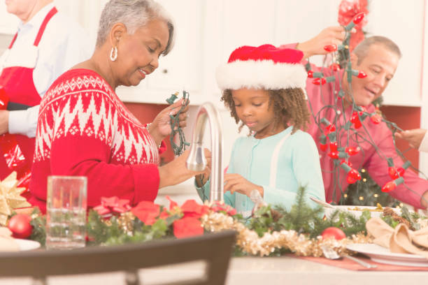 istock Multi-ethnic family in home kitchen decorating for Christmas. 870150472