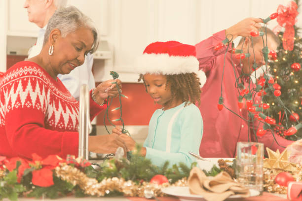 istock Multi-ethnic family in home kitchen decorating for Christmas. 870150506