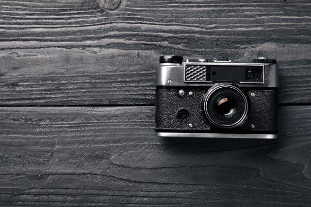 istock Camera retro. On a wooden surface. Top view. Free space for your text. 870150848