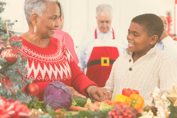istock Multi-ethnic family in home kitchen preparing Christmas dinner. 870154204