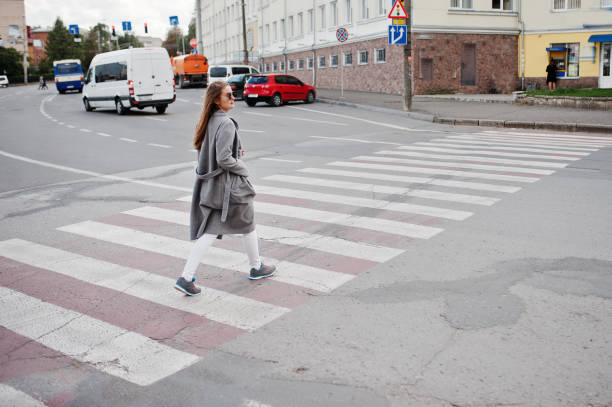 istock Girl in gray coat with sunglasses 870160858