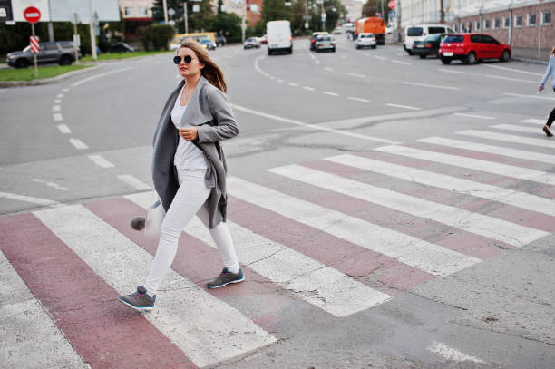 istock Girl in gray coat with sunglasses 870160936
