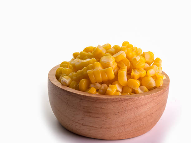 istock Grains of ripe corn isolated on white background. 870165960