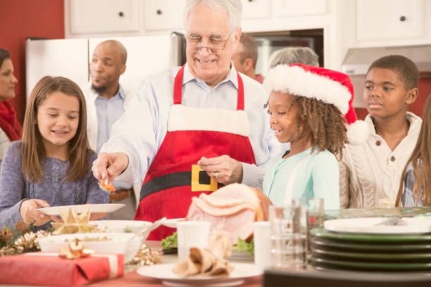 istock Multi-ethnic family in home kitchen preparing Christmas dinner. 870172392
