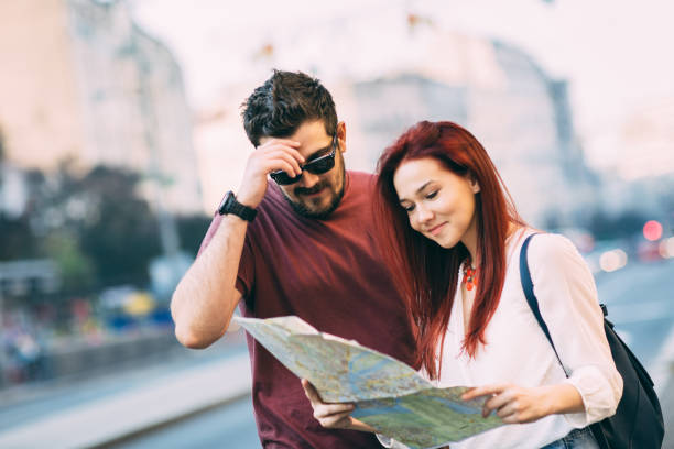 Travel Young couple traveler lost in the city using map 3686 stock pictures, royalty-free photos & images
