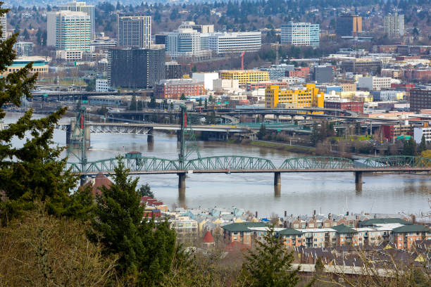 hawthorne bridge by waterfront condos over willamette river in portland or usa - portland oregon oregon waterfront city imagens e fotografias de stock