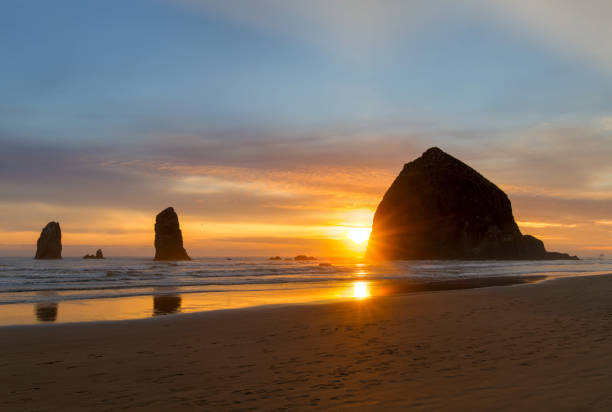 Haystack Rock and the Needles at Cannon Beach on the Oregon Coast during Sunset United States America