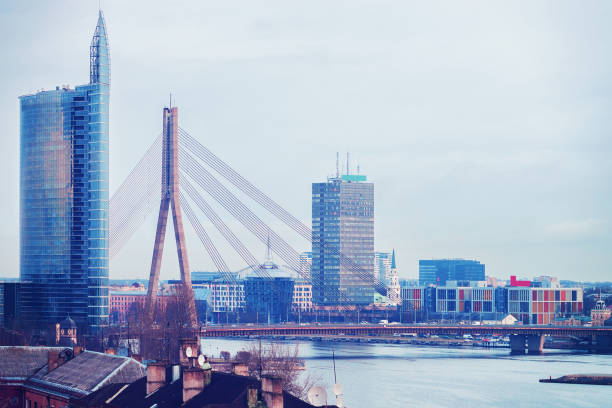 istock Riga downtown and Vansu Bridge above Daugava River at sunset 870177008