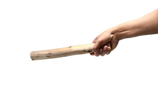 istock image of violence, adult hand holding timber and point it forward 870180976