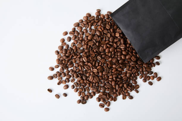 coffee beans spilling out from the package - bag coffee bean bean food imagens e fotografias de stock