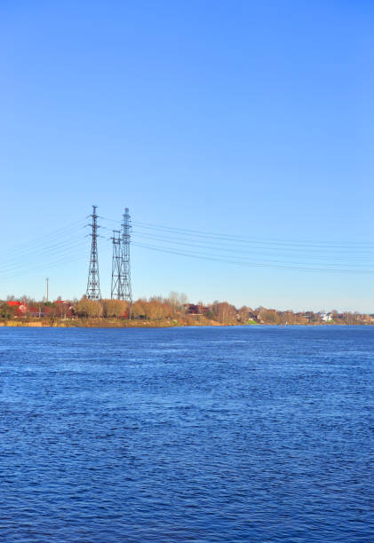 istock Power line and Neva River at autumn. 870183902