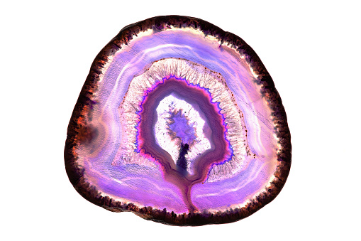 A macro photo of a colorful purple agate stone.  I illuminated it from behind to bring out the interesting mineral textures and deep purple colors.  