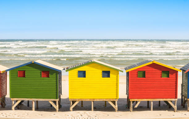 istock Multicolored beach huts at St James and Muizenberg seaside near Simon Town - Atlantic pacific coast near Cape Town in South Africa - Wanderlust ravel concept with worldwide beautiful destinations 870188852