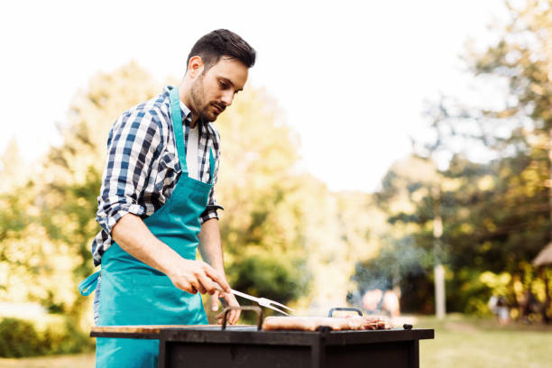 istock Happy male preparing bbq meat 870192284