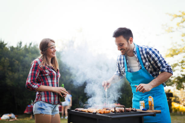 istock Happy students having barbecue on summer day 870192564