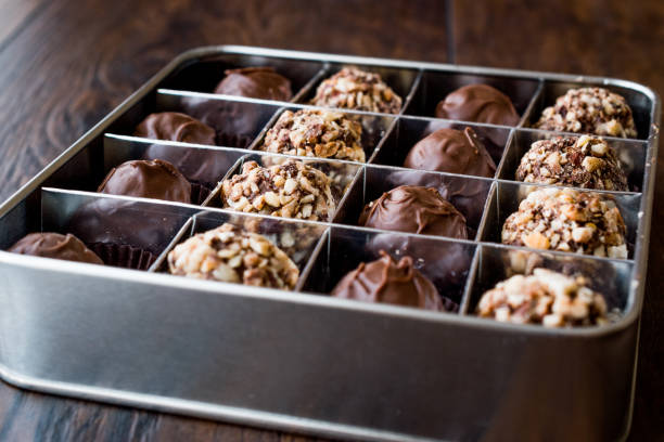 istock Box of Chocolate Pralines with Hazelnuts. 870195772
