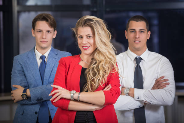 Confident business colleagues standing together
