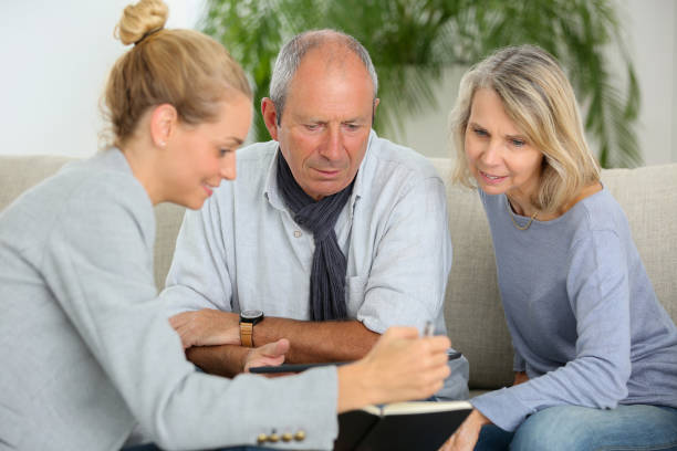 istock agent explaining planning to senior couple 870198758