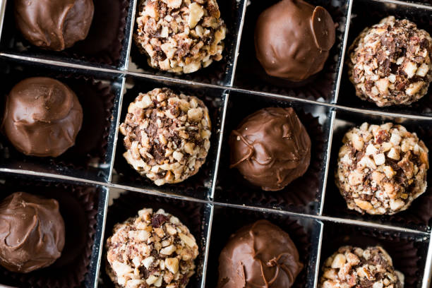 istock Box of Chocolate Pralines with Hazelnuts. 870198810