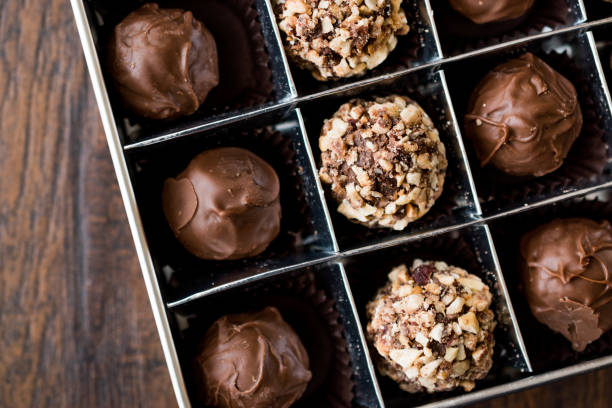 istock Box of Chocolate Pralines with Hazelnuts. 870198822