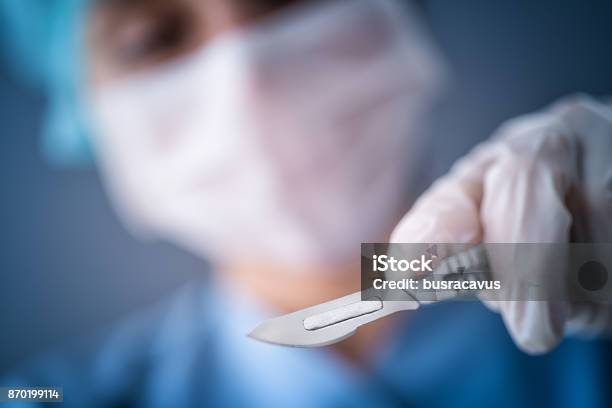 Surgeon Doctor With A Scalpel Stock Photo - Download Image Now - Scalpel, Surgeon, Operating Room