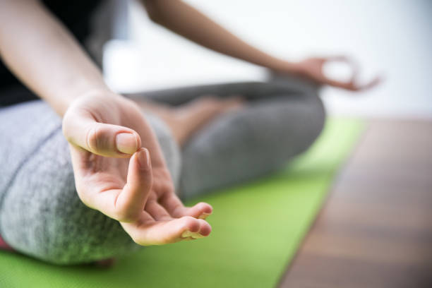 istock Woman doing yoga at home 870199196