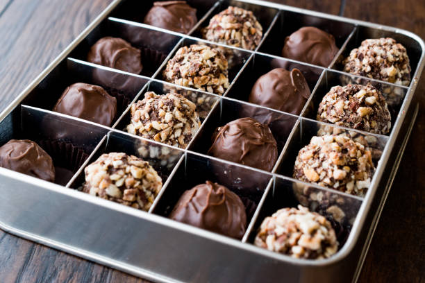 istock Box of Chocolate Pralines with Hazelnuts. 870199494