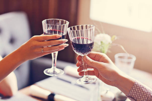 istock Couple eating romantic Dinner in a gourmet restaurant drinking wine and holding hands 870199800