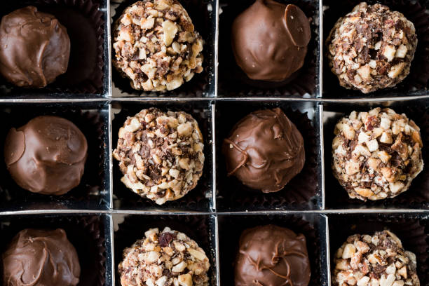 istock Box of Chocolate Pralines with Hazelnuts. 870199940
