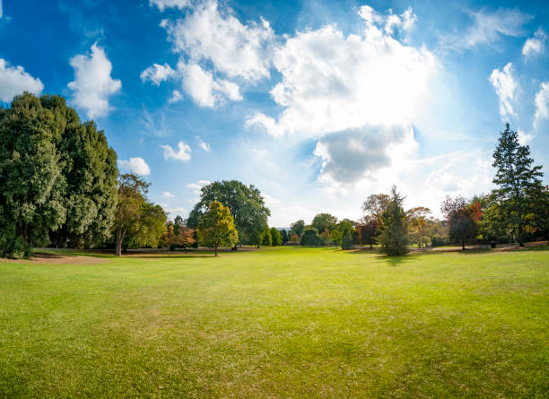 Dramatic Sky Over A Public Park Public Park In Cheltenham, United Kingdom panorama park stock pictures, royalty-free photos & images
