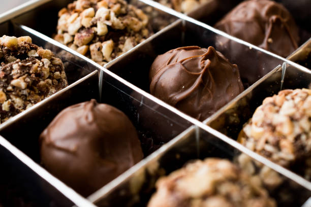 istock Box of Chocolate Pralines with Hazelnuts. 870200404
