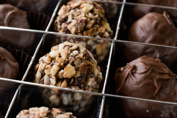 istock Box of Chocolate Pralines with Hazelnuts. 870203346