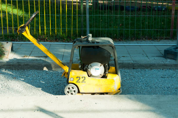 istock Compactor machinery at street reconstruction site 870203540