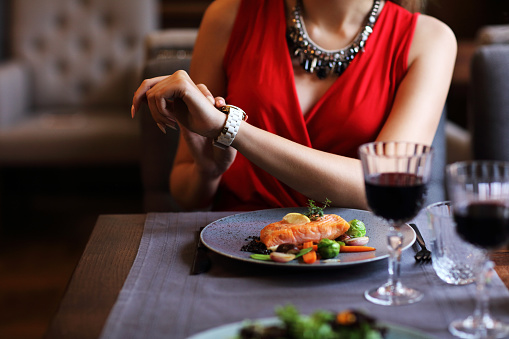 Picture showing bored Woman Alone at Restaurant