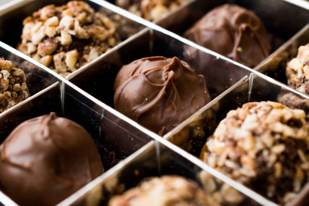 istock Box of Chocolate Pralines with Hazelnuts. 870203606
