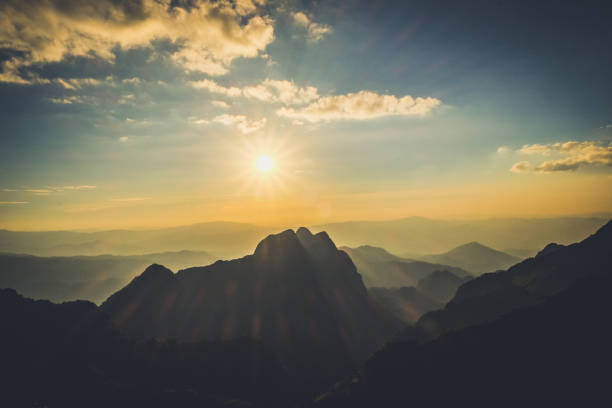 istock Mountain landscape with moody backlight sunrise sky background 870204260