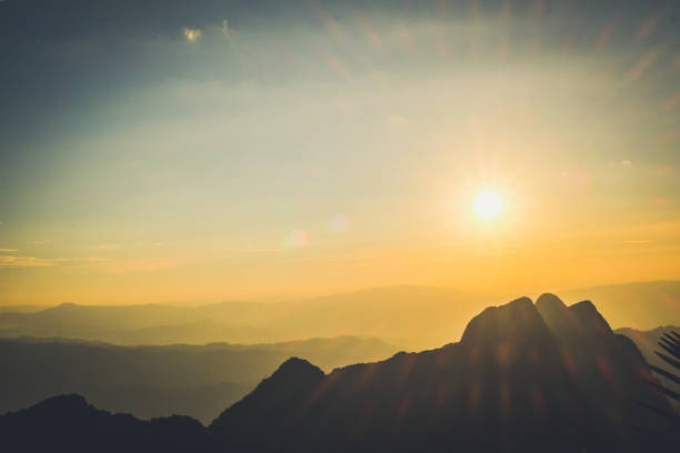 istock Mountain landscape with moody backlight sunrise sky background 870204296