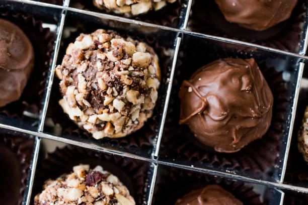 istock Box of Chocolate Pralines with Hazelnuts. 870204688