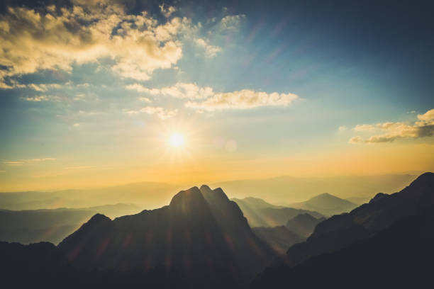 istock Mountain landscape with moody backlight sunrise sky background 870206820