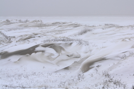 Winter storms on the North Sea islands mix the snow with the sand of the dunes and form impressive natural structures.