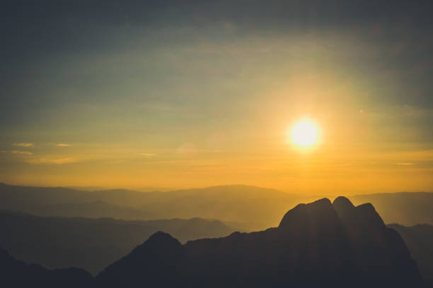 istock Mountain landscape with moody backlight sunrise sky background 870207200