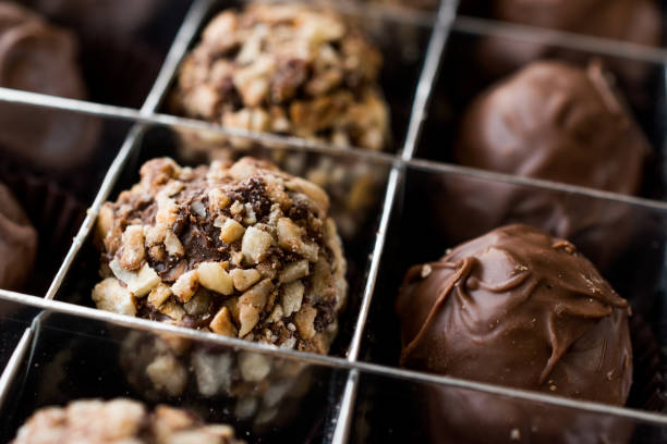 istock Box of Chocolate Pralines with Hazelnuts. 870207232