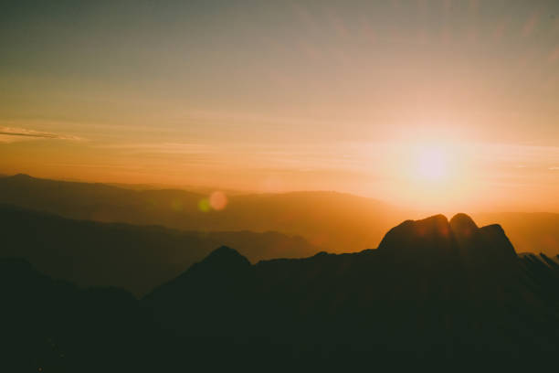 istock Mountain landscape with moody backlight sunrise sky background 870207266