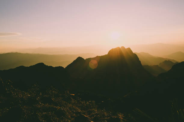 istock Mountain landscape with moody backlight sunrise sky background 870207268