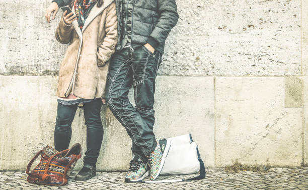 istock Multiracial couple on phase of mutual disinterest using phone - Modern relationship breakup concept on always connected people - City urban lifestyle and everyday life rapport - Retro contrast filter 870214198
