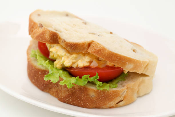 istock Sandwich with egg tomato lettuce isolated on white background 870214262