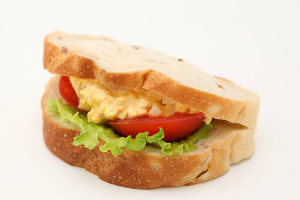 istock Sandwich with egg tomato lettuce isolated on white background 870214456