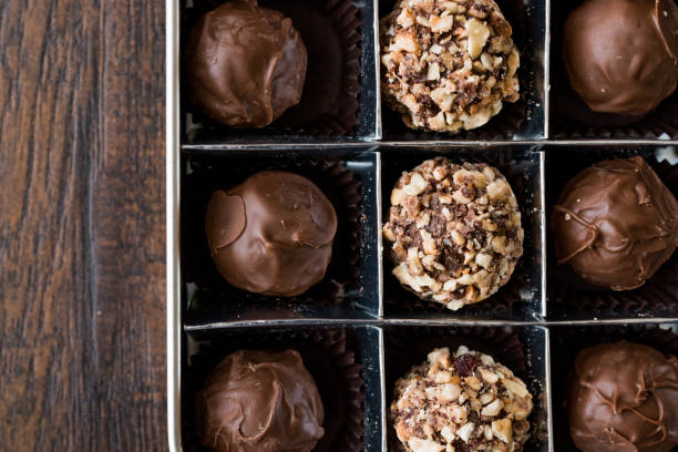 istock Box of Chocolate Pralines with Hazelnuts. 870214722